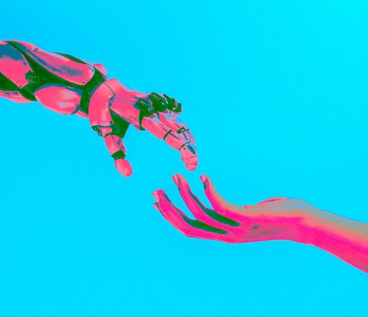 Robot hand and human hand, reminiscent of the fresco The Creation of Adam
